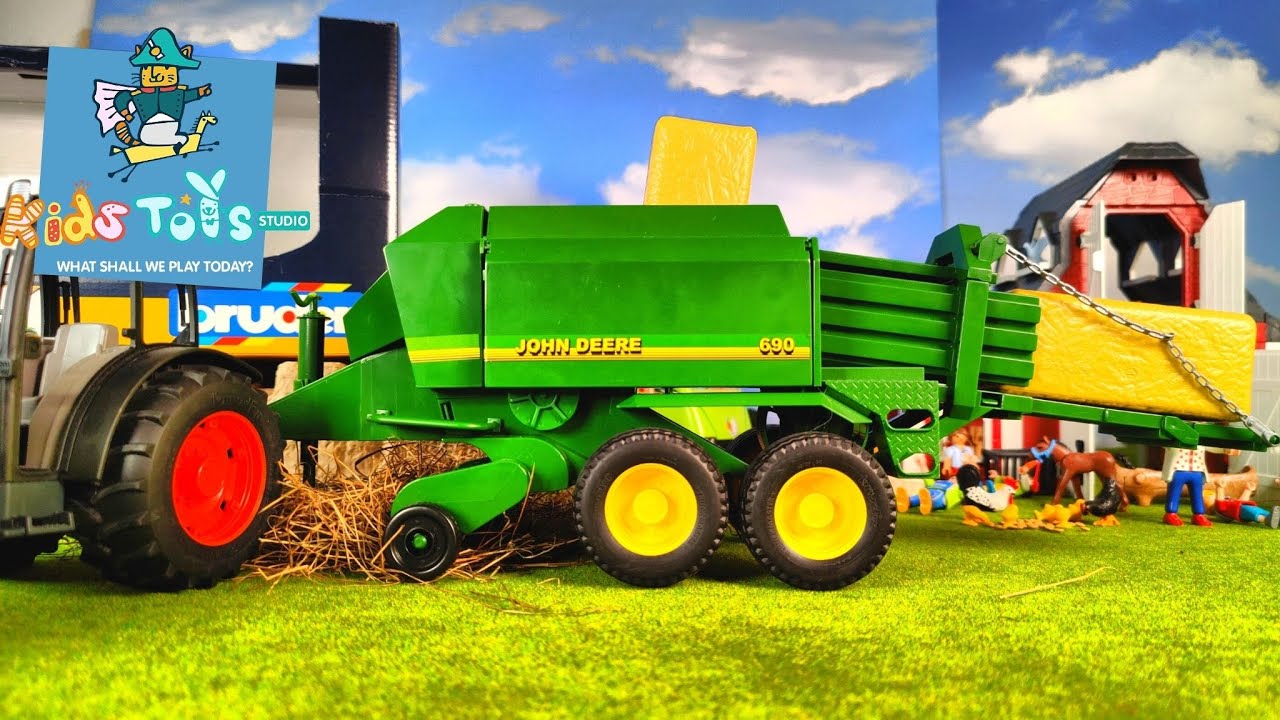 'Video thumbnail for Bruder John Deere Big Bale Press (Balenpers) Unboxing & mowing hay into bales on the farm with baler'